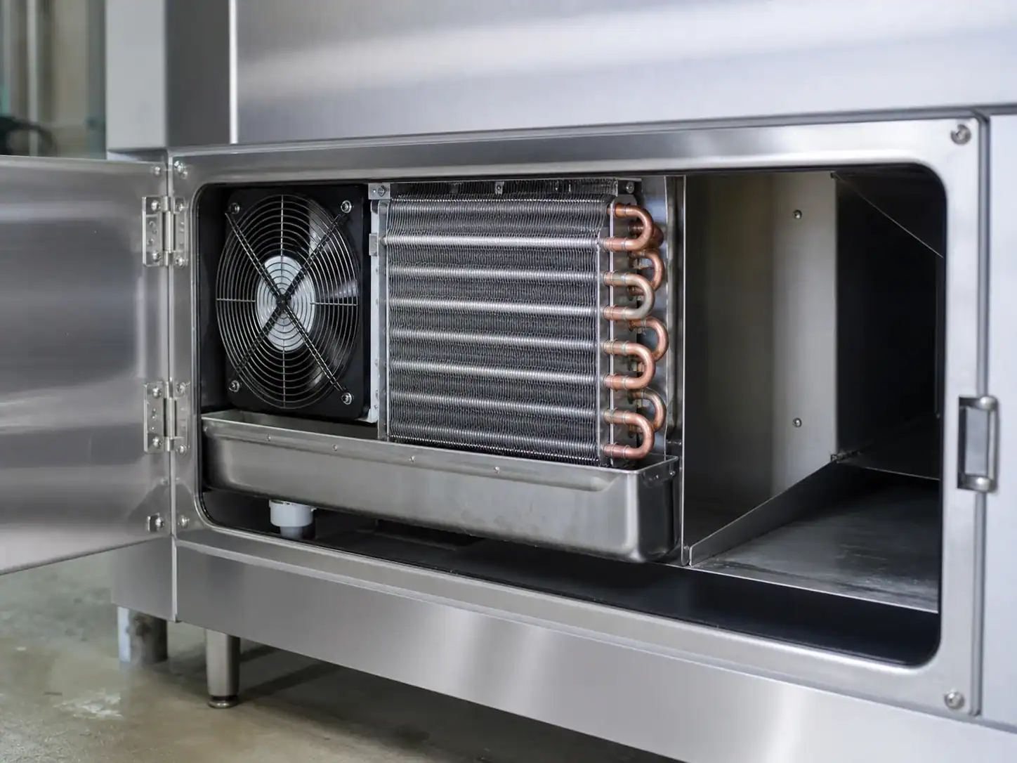 Commercial freezer evaporator coil, fan, drain pan, and air channel
