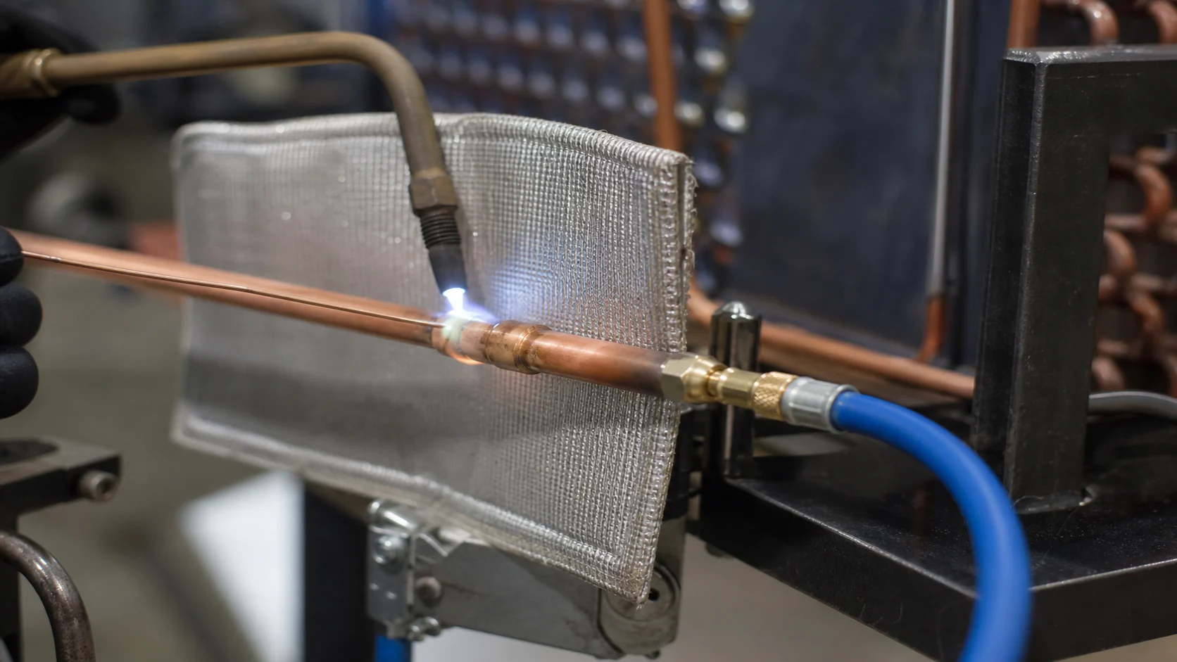 Copper refrigeration connection being brazed with a visible nitrogen purge setup