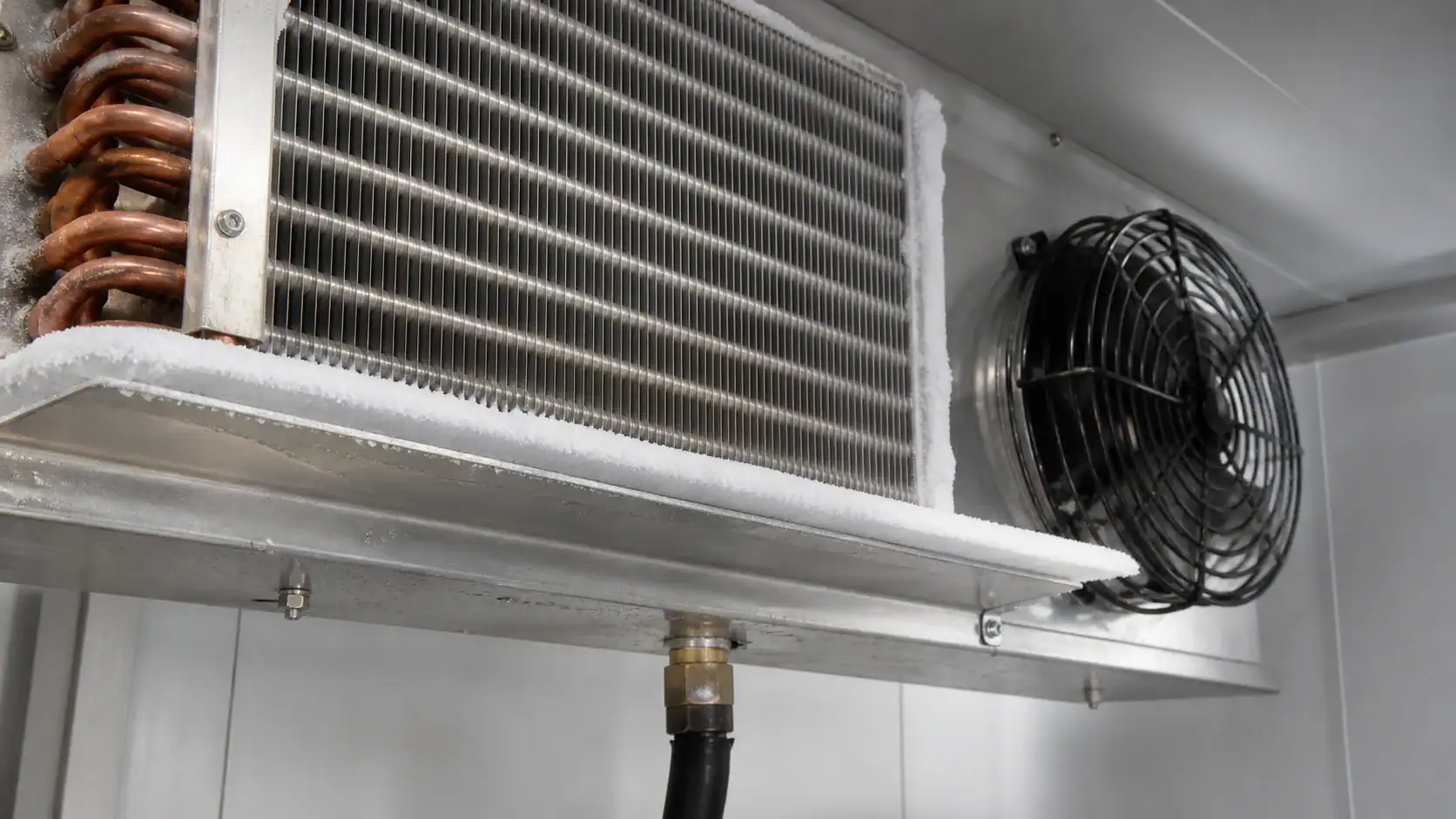 Industrial refrigeration system with cooling coil and fan for commercial use.