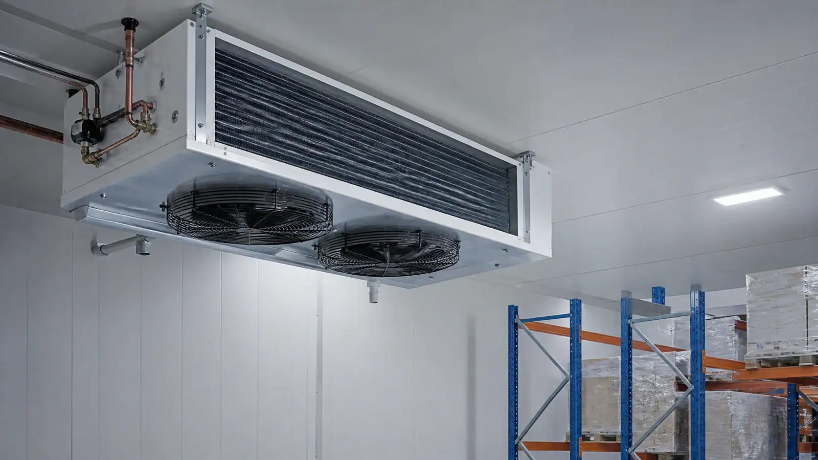 Large commercial refrigeration unit with cooling fans in a storage room.